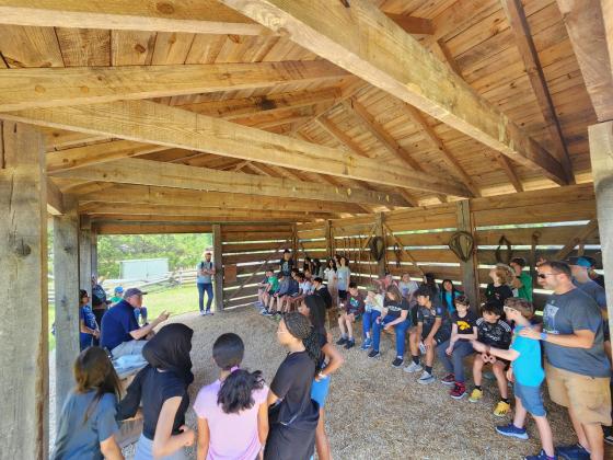 Students in barn at White Oaks at Pamplin