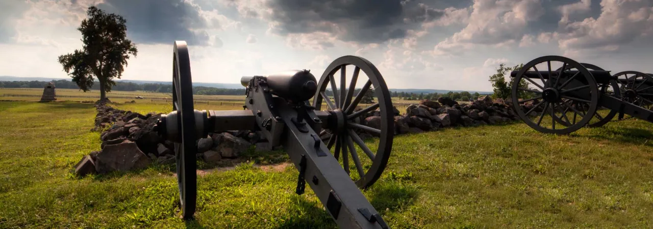 Artillery pointed across a field