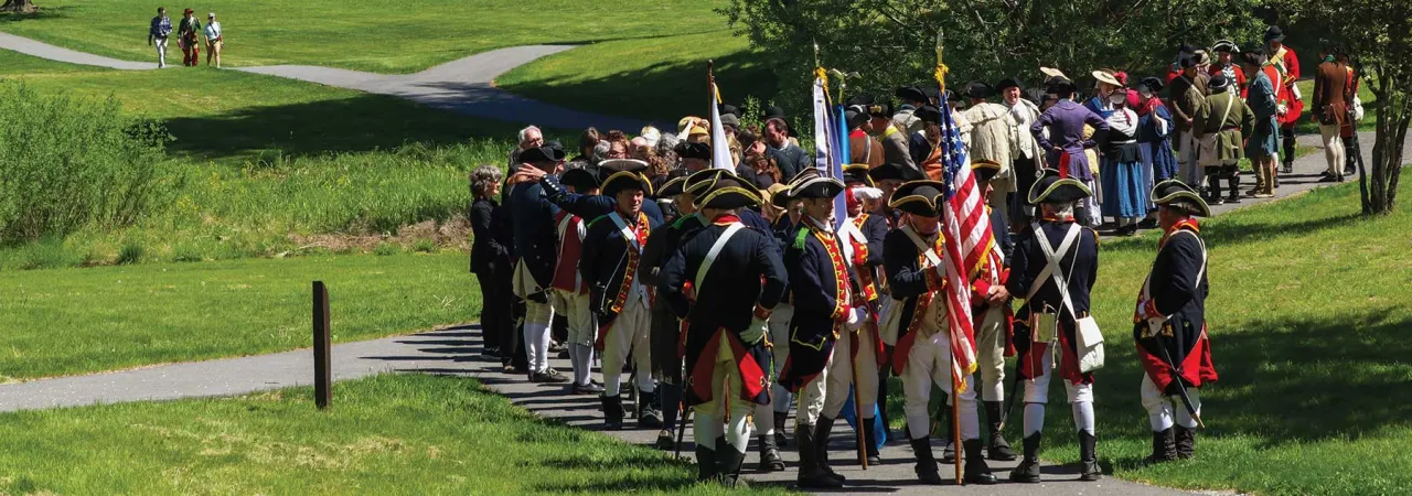 Participants make their way in solemn procession to the Repose of the Fallen memorial, accompanying the remains on the final leg of their journey to a permanent resting place.