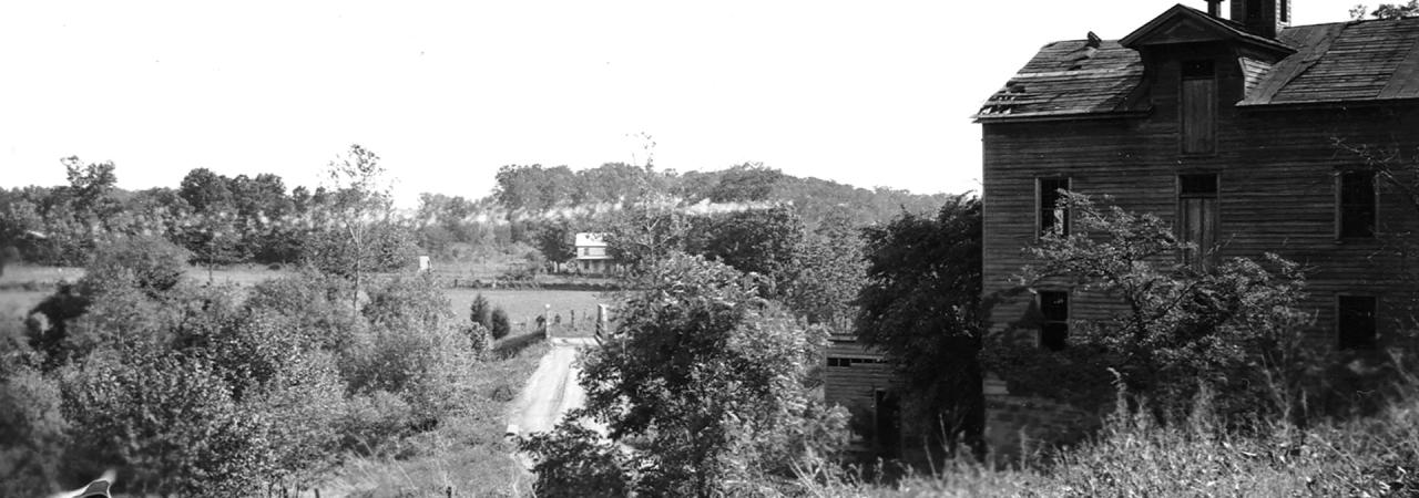 Ca. 1930 photograph looking south from Sudley Mill toward our latest target tract directly across the early 20th-century bridge over Catharpin Run.