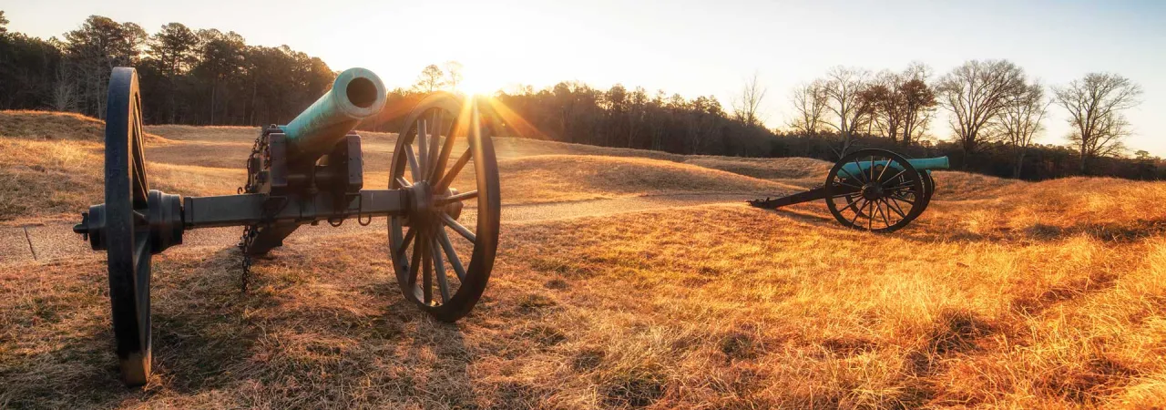 Two cannons at sunset at the Petersburg Breakthrough Battlefield, Va.