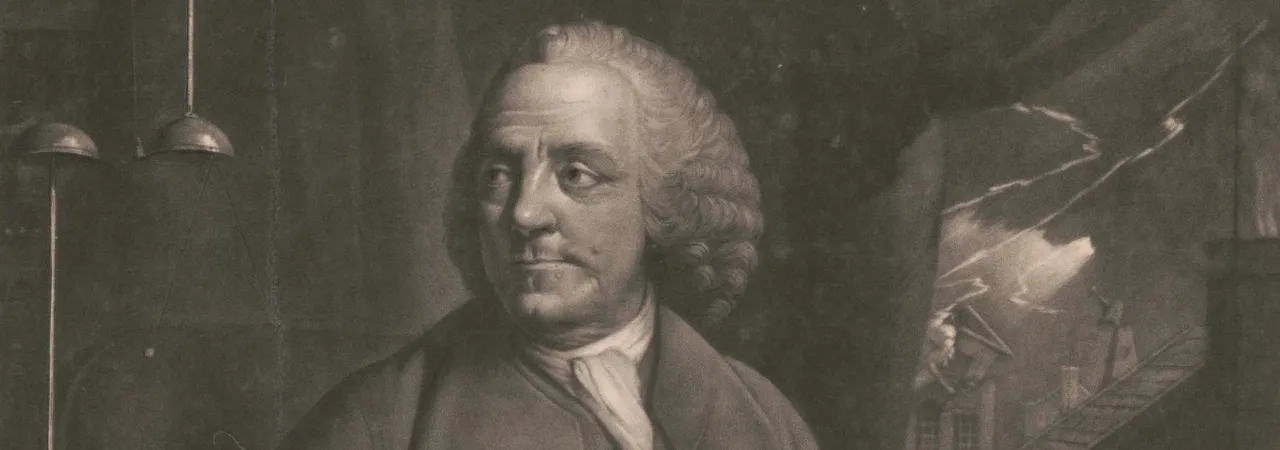 Print shows Benjamin Franklin, three-quarter length portrait, seated at desk, looking to his right at an electrical device, in his left hand are papers upon which he is taking notes, and visible through a window to his left is lightning striking a building.