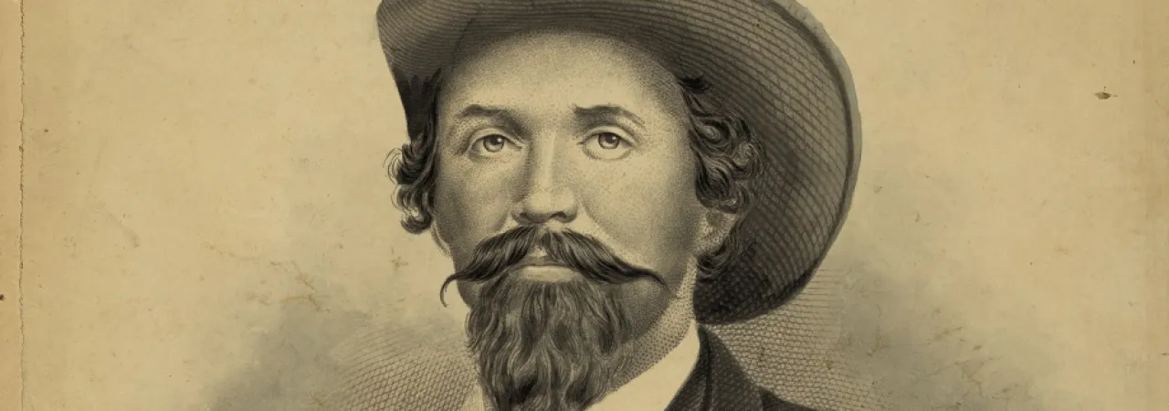 19th century portrait of man with a handlebar mustache wearing a western-type hat and a suit