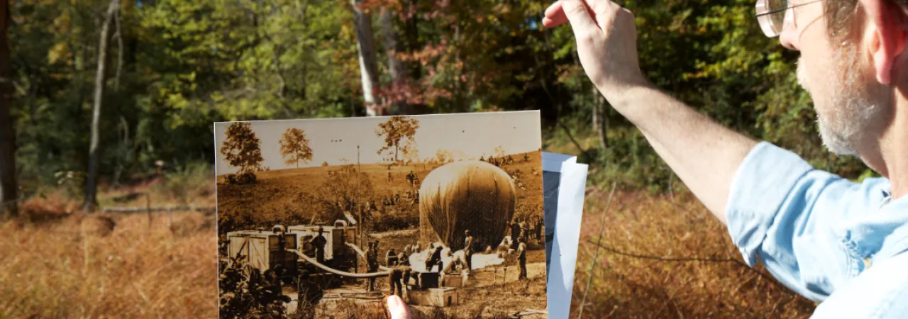 Dr. James L. Green with a Picture of the 'Intrepid'