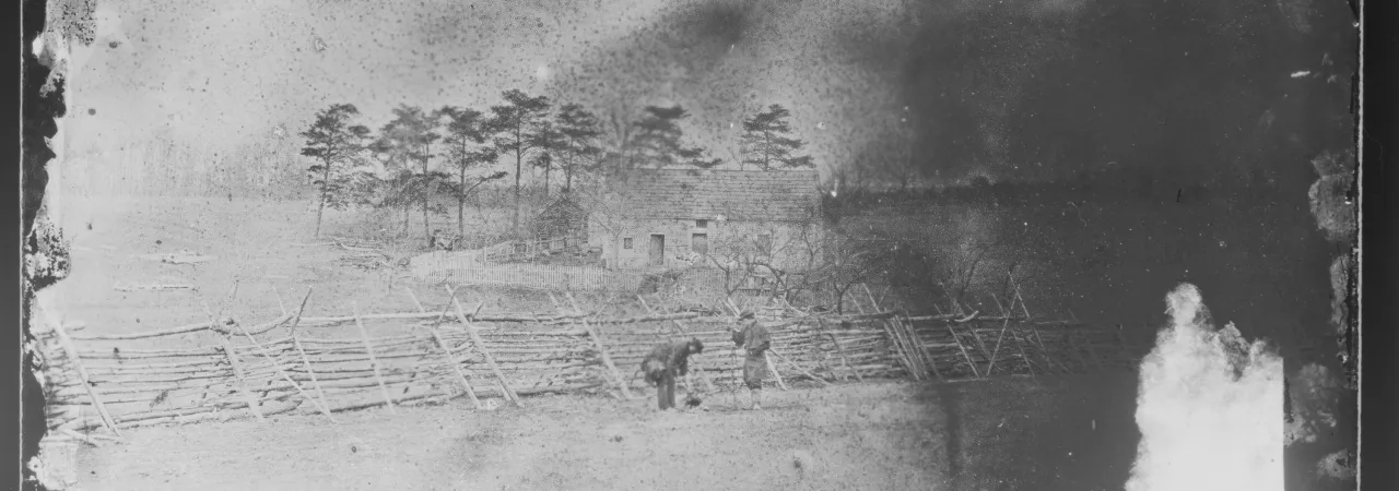 Civil War photograph of Union soldiers on picket duty preparing coffee around a small outdoor fire.
