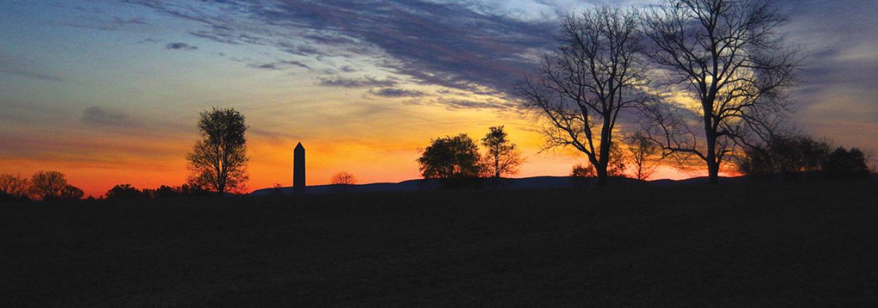 This is a picture of a sunset over a battlefield. 