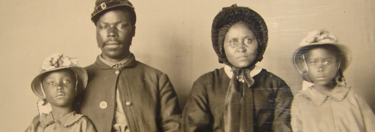 Unidentified African American soldier in Union uniform with wife and two daughters