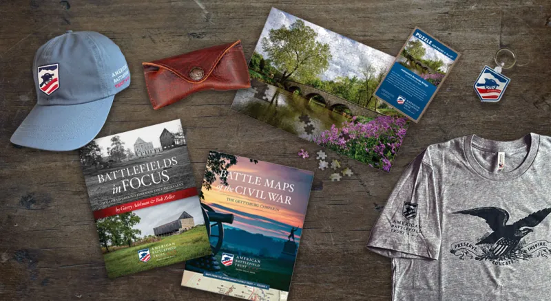 A selection of products sold in the Trust store, including shirts, glasses, books, bags and hats