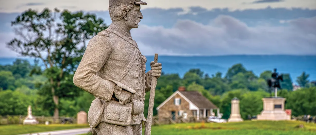 Monument of a federal loading his musket at Gettysburg