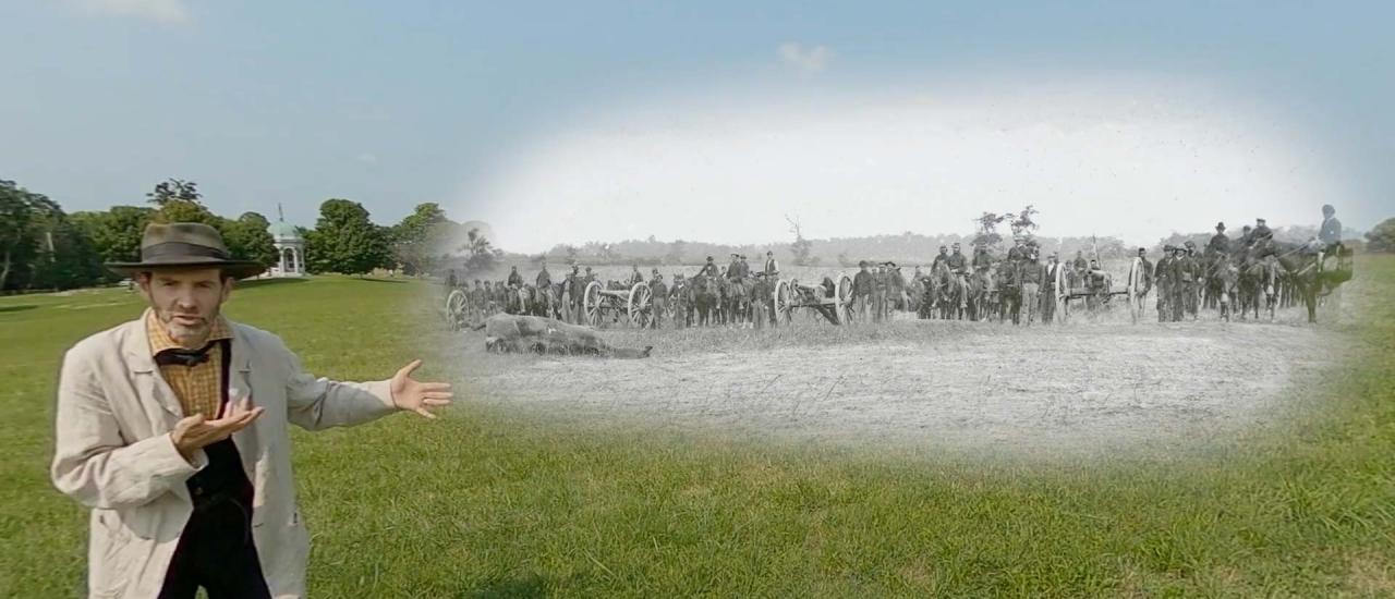 Garry Adelman at Antietam with a historic photo of Captain J.M. Knap's Penn. Independent Battery "E" Light Artillery