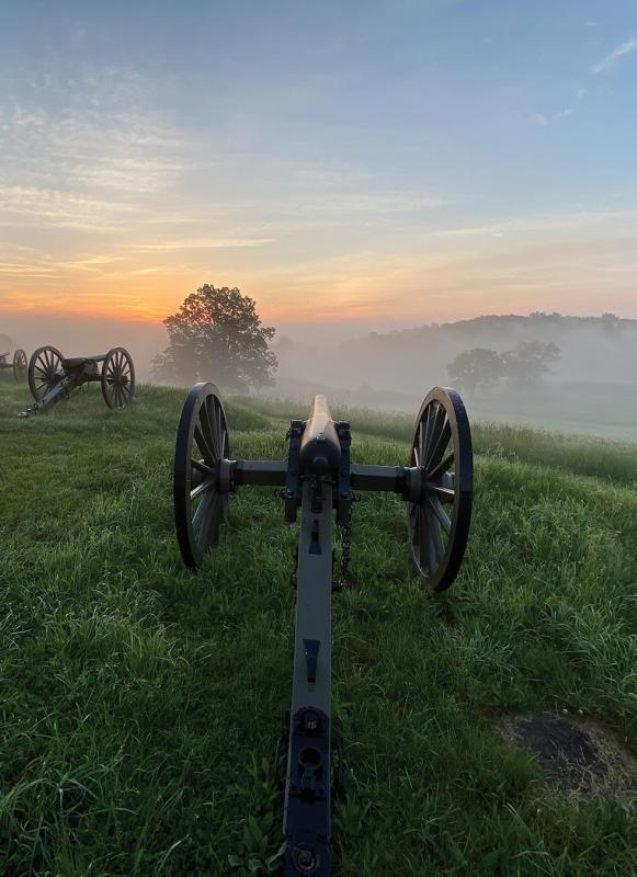 Cannons atop East Cemetery Hill on a misty summer morning.
