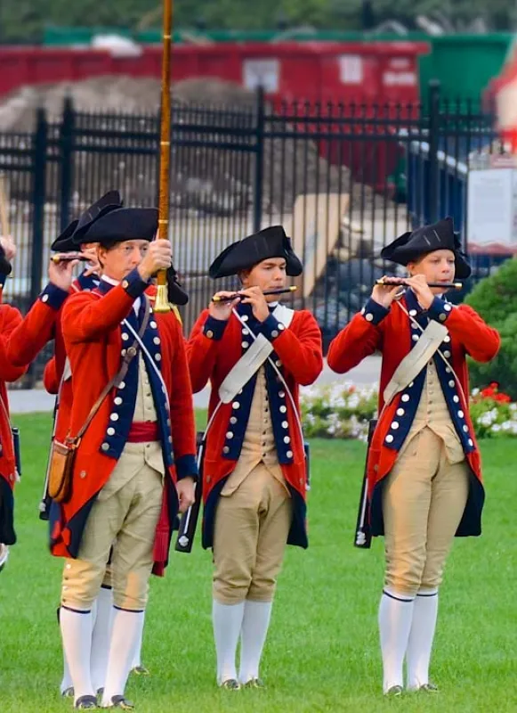 Revolutionary War Reenactors stand with Fifes in formation by Jamie McCaffrey