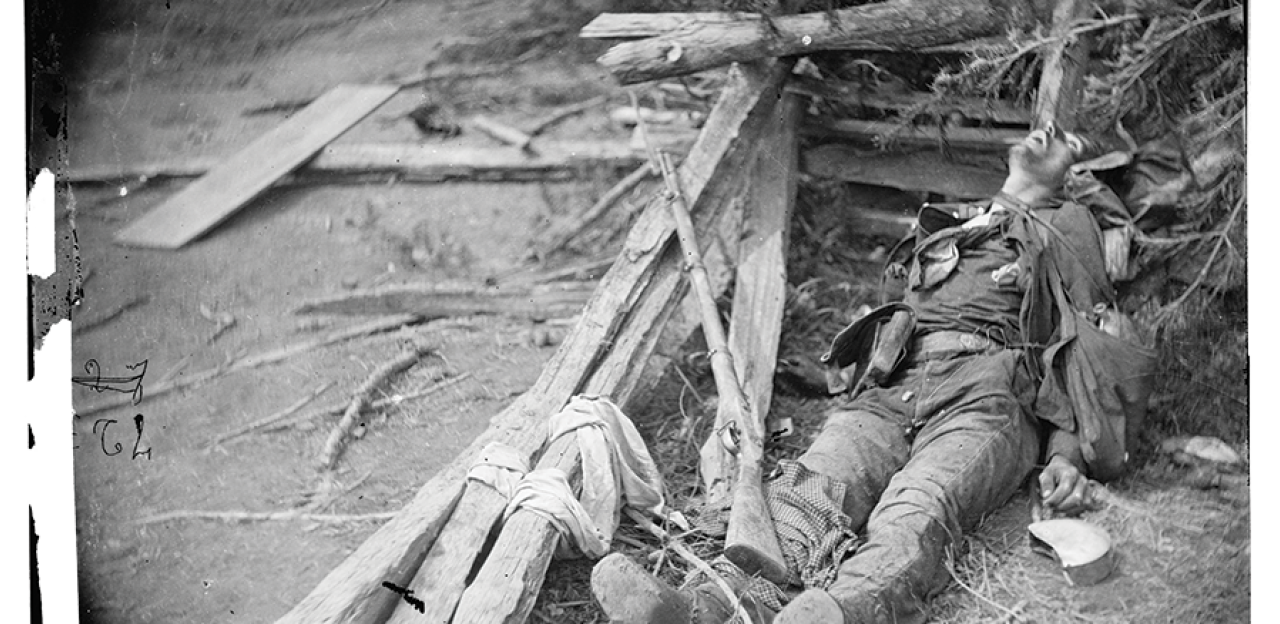This photograph shows a soldier lying dead in the rubble of Spotsylvania.
