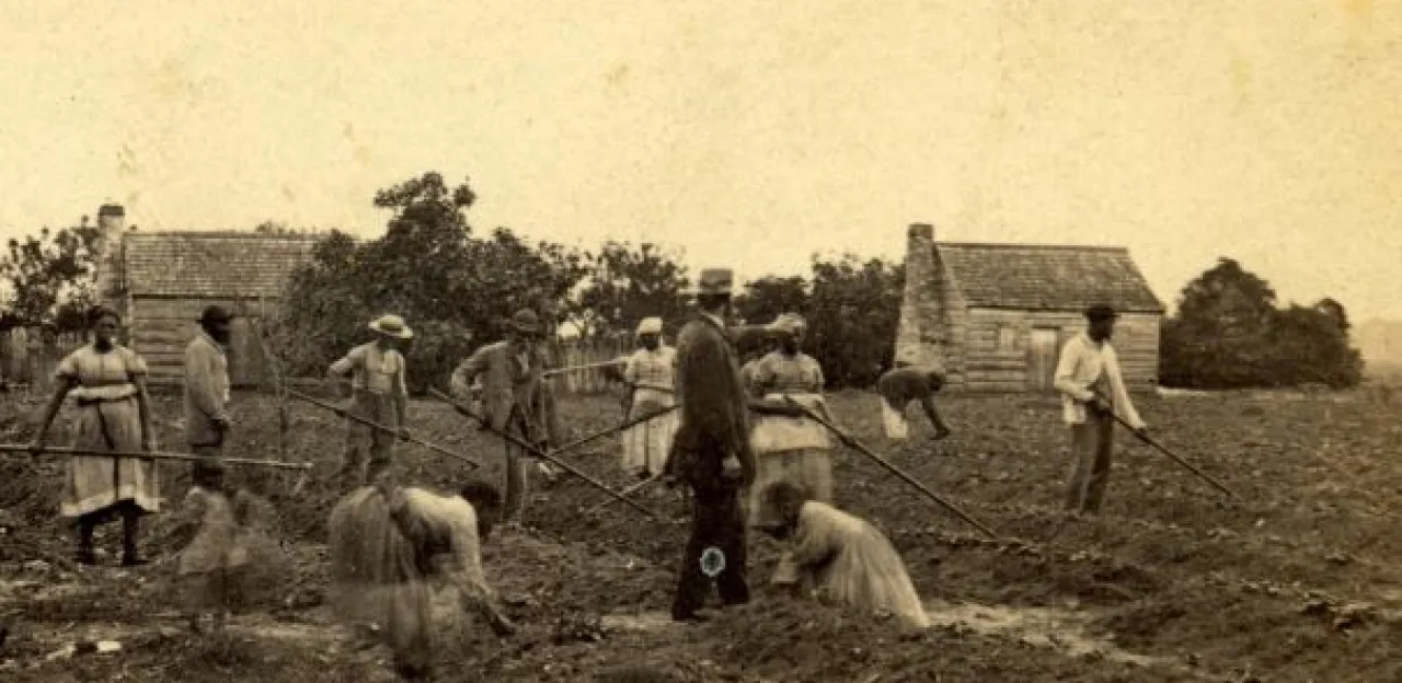Plantation superintendent standing amidst enslaved persons on St. Helena Island, South Carolina