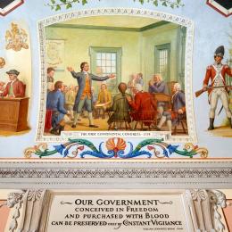 Mural from the U.S. Capitol shows delegates at Carpenter's Hall in Philadelphia discussing responses to increased British oppression.