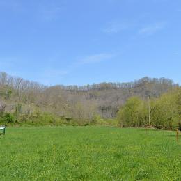 Battlefield with a sign in the mid-ground. 