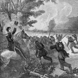 Union soldiers charge uphill through smoke and dense woods during the Battle of Rich Mountain, Virginia, on July 13, 1861, while officers lead the advance with drawn swords and Confederates resist from concealed positions. Wood engraving by William John Hennessy, published in Harper's Weekly (1861).