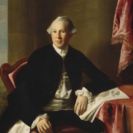 Painting of a seated man with a black coat and white wig. 