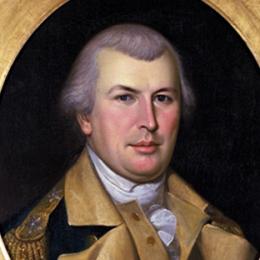 Portrait of a man in an oval frame wearing a blue uniform coat of the Continental Army with buff lapels and epaulets on his shoulders. 