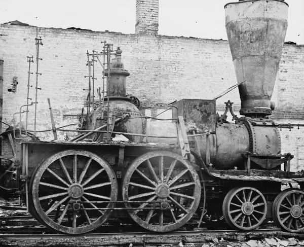 Black and white photograph a a damaged locomotive