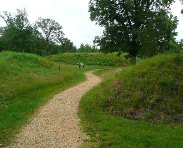 A path leads through Fort Harrison and a marker is seen in the distance.