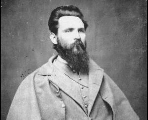 Photograph of a man with a beard and a Confederate uniform. 