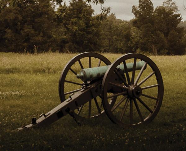 A photograph of a cannon and trees at Manassas National Battlefield Park