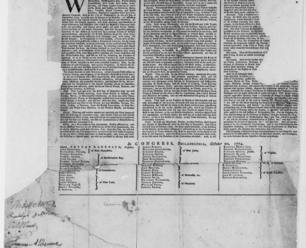 Black and white photocopy of a document, torn and distressed in places. 
