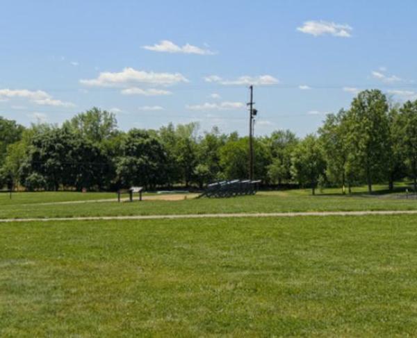 This is a photograph of a battlefield's green grass. 