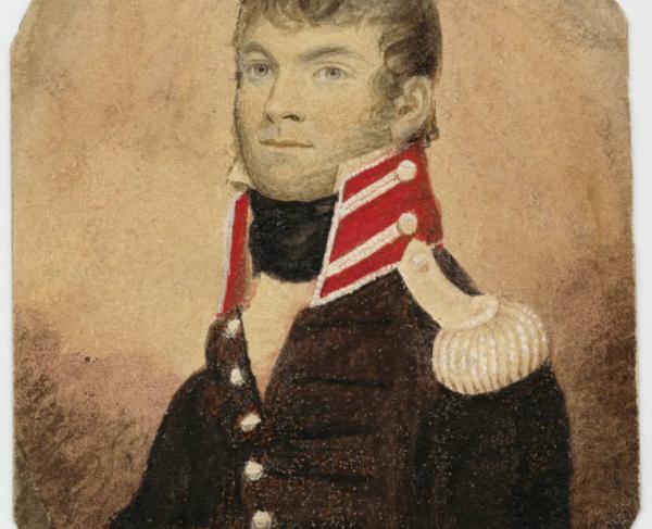 Bust portrait of Captain William Wells.  He wears a dark uniform coat with high red collar trimmed in white. He has white epaulettes covering his coat's shoulders.