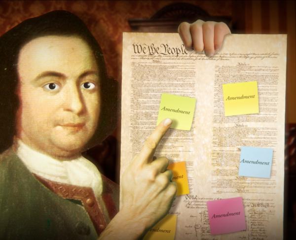 George Mason holding the U.S. Constitution covered in modern Post-It notes marked "Amendment." 