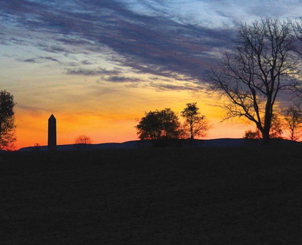 This is a picture of a sunset over a battlefield. 