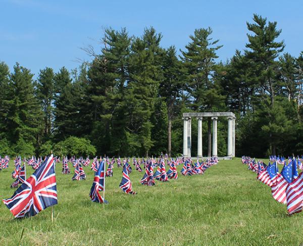 American and British flags waving on the grounds of the Princeton Battlefield