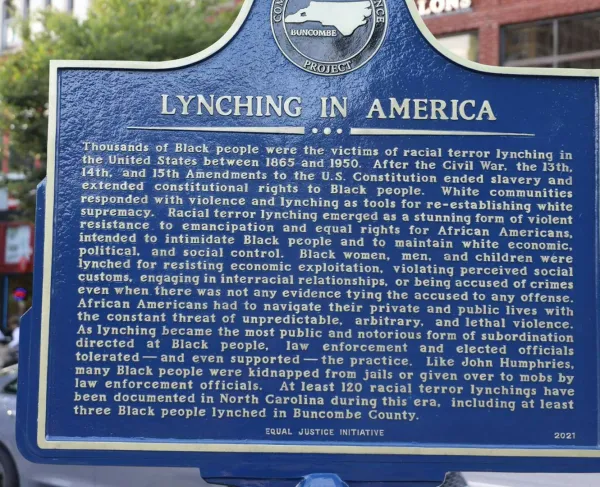 Lynching in America reverse of the Lynching of John Humphries Historical Marker in Pack Square Park