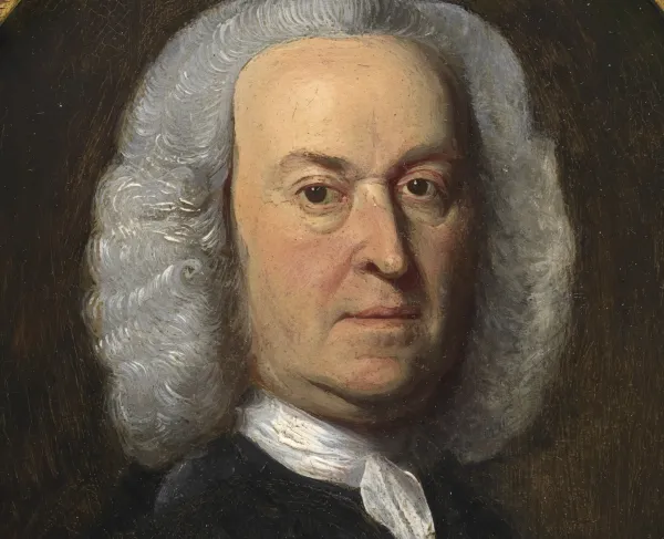 Portrait of a man in a white wig and black coat. 