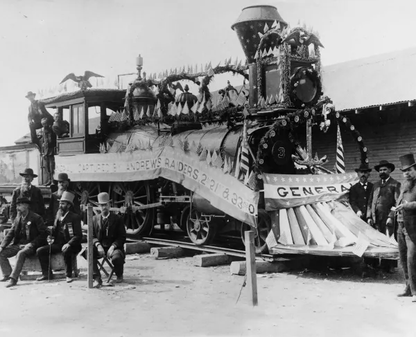 Ten of the 11 surviving Andrews’ Raiders posing by the General along with Capt. William A. Fuller at the Grand Army of the Republic Encampment in Columbus, Ohio, August 1888. On the train, left to right: John A. Wilson, Wilson W. Brown, William J. Knight. Standing below: Elihu H. Mason, William H. Reddick. Seated: John Wollam, Daniel A. Dorsey, William Pittenger Right side, in front of locomotive: WIlliam Bensinger, Jacob Parrott, Texas captain William A. Fuller.