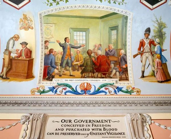 Mural from the U.S. Capitol shows delegates at Carpenter's Hall in Philadelphia discussing responses to increased British oppression.