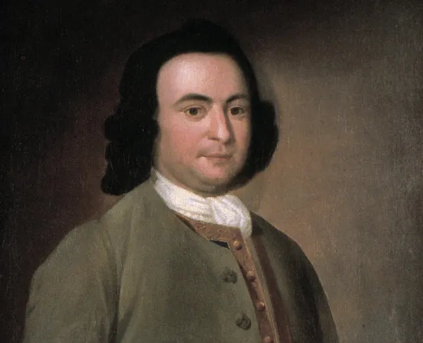 Oil portrait of a young George Mason wearing an 18th-century brown coat, embroidered waistcoat and white neckcloth.