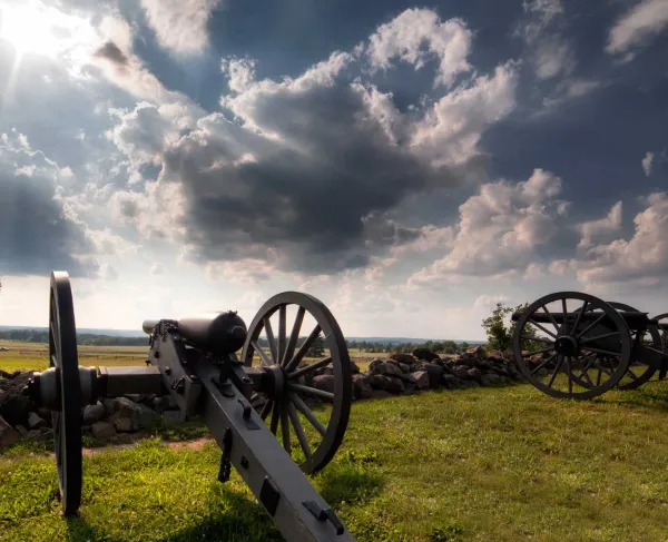 Artillery pointed across a field