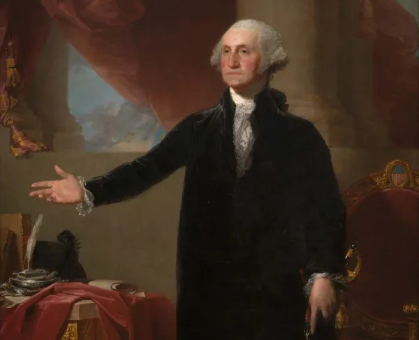 Full-length portrait by Gilbert Stuart of George Washington standing beside a table, dressed in a black suit and extending one hand outward.