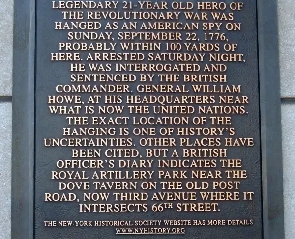 Commemorative plaque explaining where Nathan Hale was likely executed during the Revolutionary War.