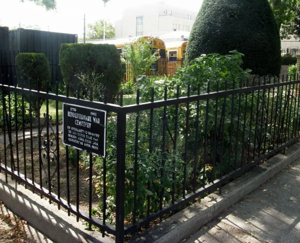 Small Revolutionary War Cemetery in Brooklyn NY with rod iron fence around it