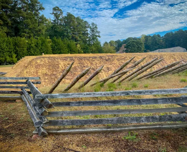 Replica trenches lined with sharpened defenses bring the brutal reality of Civil War combat into focus.