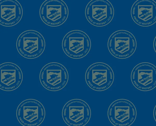 Navy background with gold logo emblazoned. 