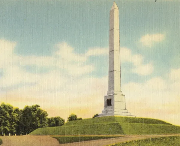 1930s-1940s Postcard of a white obelisk atop a hill.