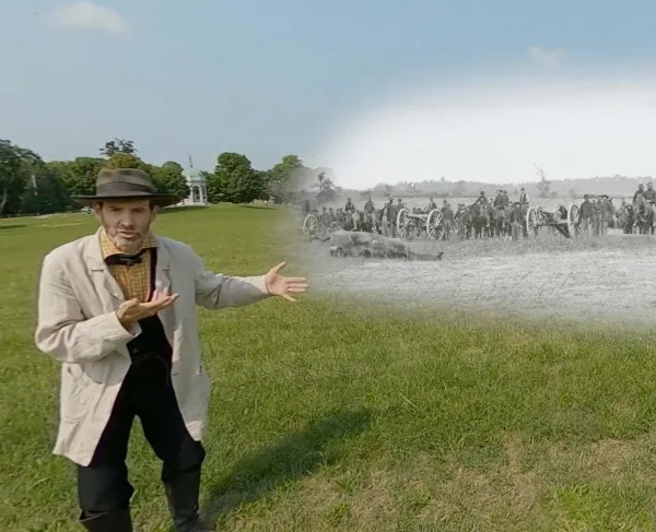 Garry Adelman at Antietam with a historic photo of Captain J.M. Knap's Penn. Independent Battery "E" Light Artillery
