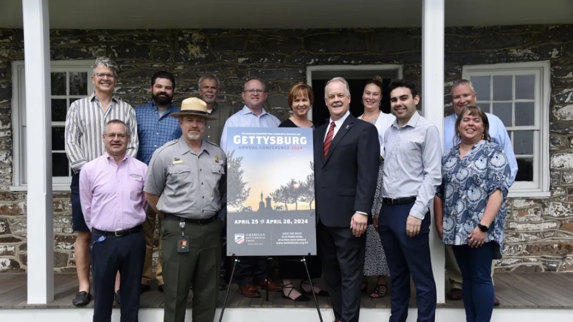 Group with poster at Lee’s Headquarters, Gettysburg