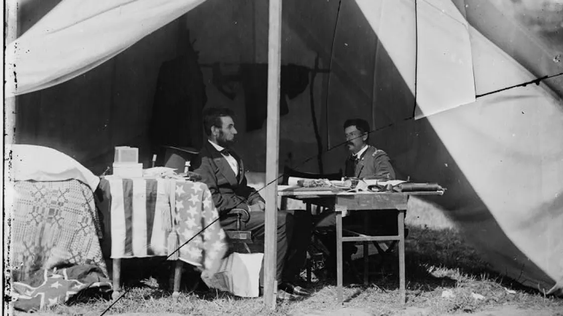 Photograph of Lincoln and McClellan seated somewhere at Antietam
