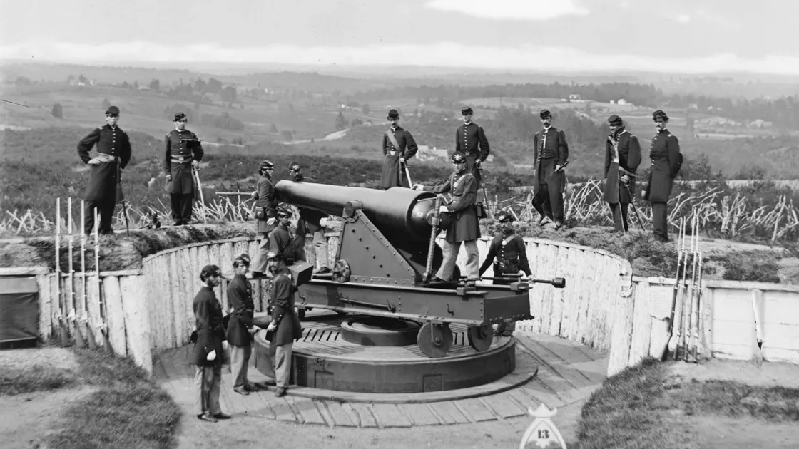 A Union gun crew poses around a Parrott Gun at Fort Totten