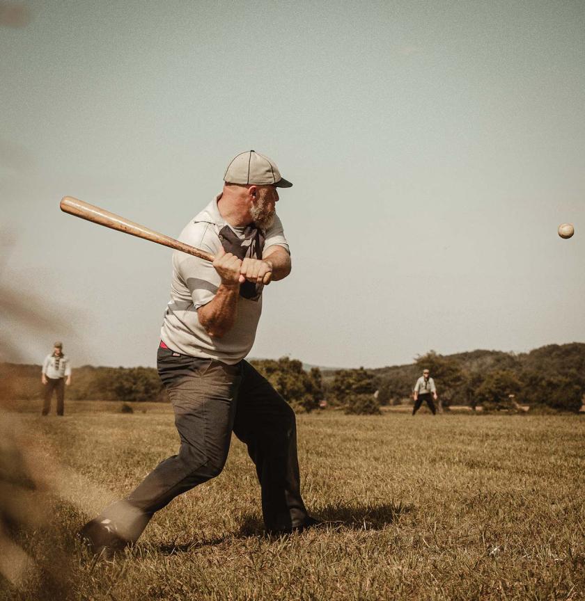 A striker from Eclipse BBC of Elkton facing a pitch from the Lisbon Tunnelmen.